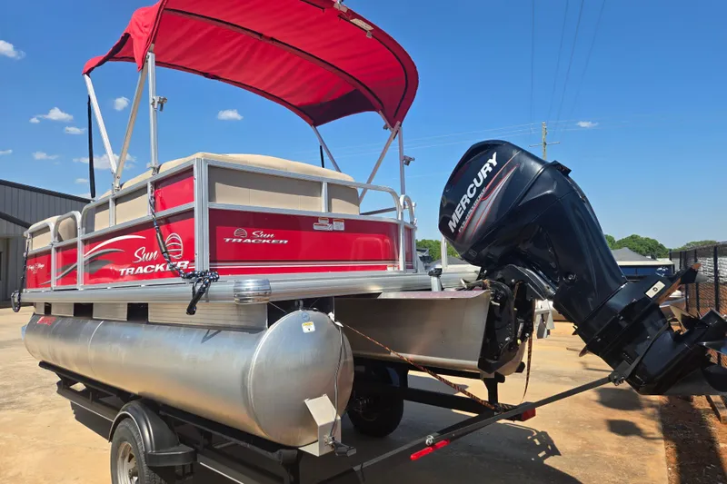 Slide: The Image of 2017 Sun Tracker Party Barge 18 DLX with Mercury outboard motor on trailer. - 15