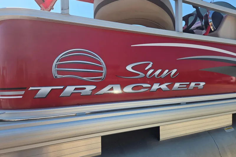 Slide: The Image of 2017 Sun Tracker Party Barge 18 DLX pontoon boat with red exterior and logo. - 18