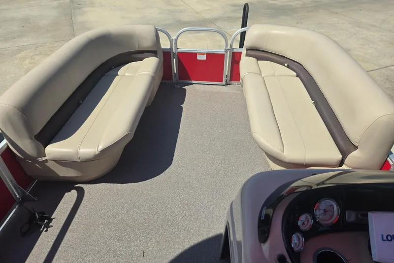 Slide: The Image of 2017 Sun Tracker Party Barge 18 DLX interior with beige seating and red accents. - 7