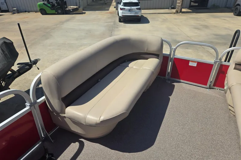 Slide: The Image of 2017 Sun Tracker Party Barge 18 DLX with beige seating and red paneling. - 9