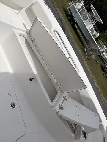 Slide: The Image of 2026 Sea Pro 202 Center Console with open storage hatch. - 10