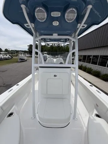 Slide: The Image of 2026 Sea Pro 202 Center Console boat with blue canopy at marina. - 11