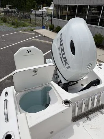 Slide: The Image of 2026 Sea Pro 202 Center Console with Suzuki engine, open storage hatch. - 20