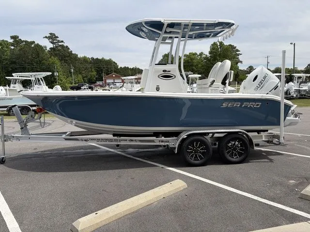 Slide: The Image of 2026 Sea Pro 202 Center Console boat parked on trailer outdoors. - 4