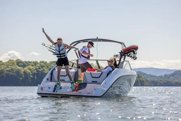 Slide: The Image of 2026 Yamaha Boats AR220 on water with people enjoying water sports. - 12