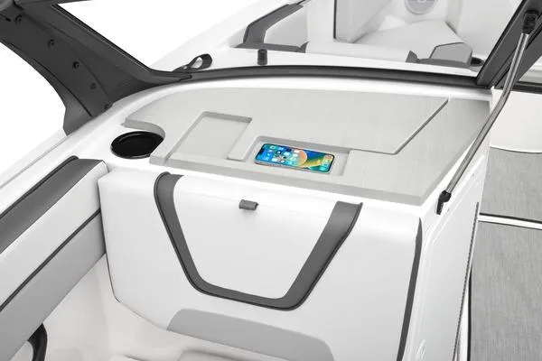 Slide: The Image of 2026 Yamaha Boats AR220 interior with smartphone holder and storage compartment. - 7