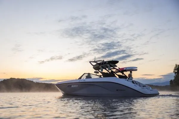 Slide: The Image of 2026 Yamaha Boats AR220 on a serene lake at sunset. - 8