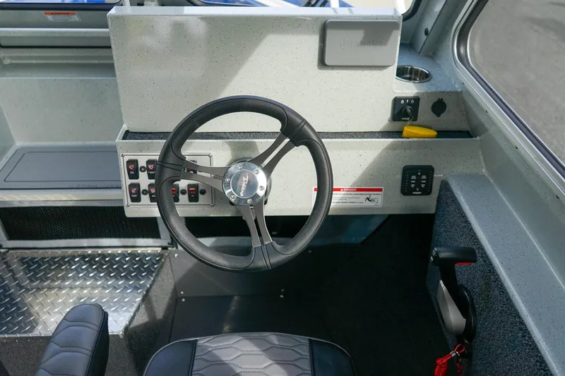 Slide: The Image of Steering console of 2026 Weldcraft 220 Ocean King boat with modern controls and sleek design. - 15