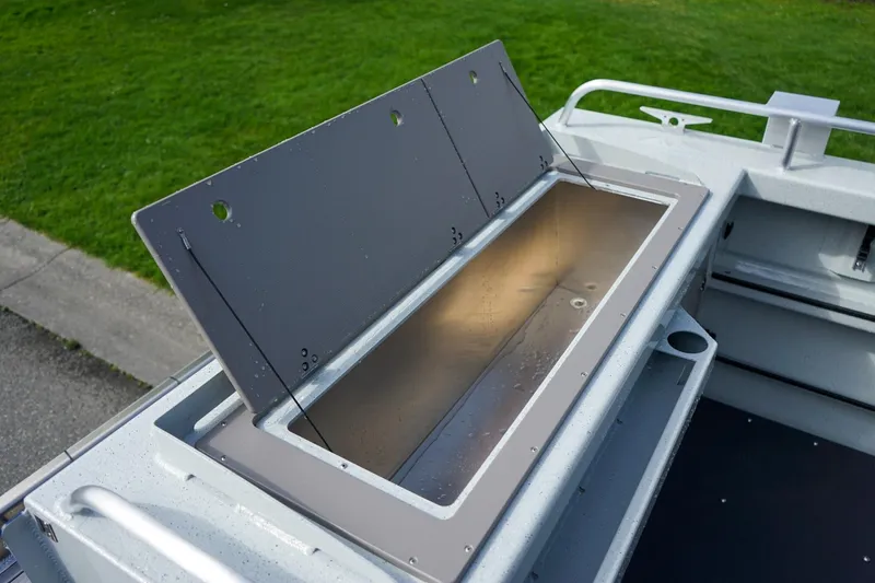 Slide: The Image of 2026 Weldcraft 220 Ocean King boat storage compartment, open lid, showcasing interior space. - 7