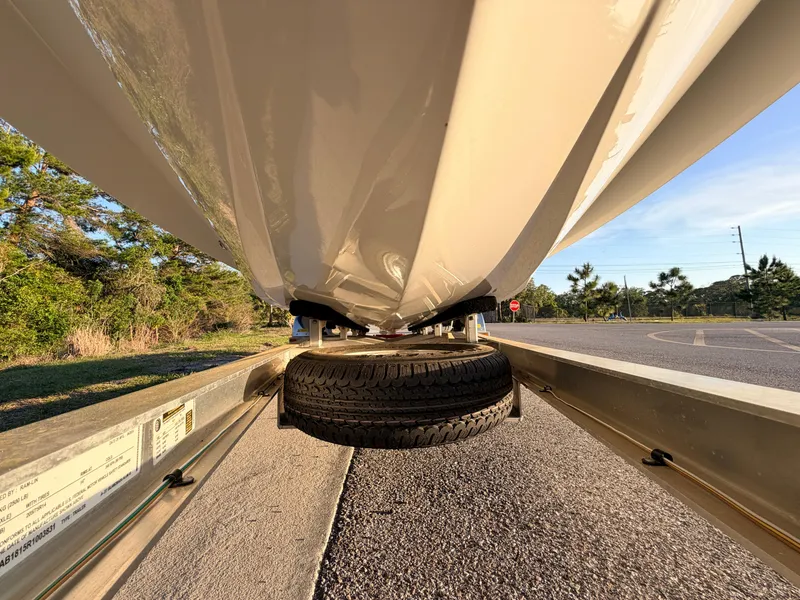 Slide: The Image of Underneath view of a 2025 Chittum Skiffs Islamorada 21 on a trailer. - 10