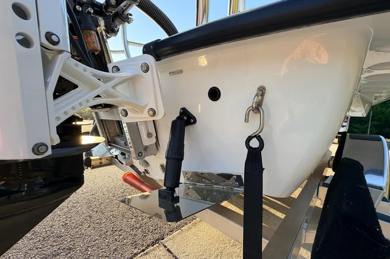 Slide: The Image of 2025 Chittum Skiffs Islamorada 21 boat transom detail with motor mount and trailer. - 12
