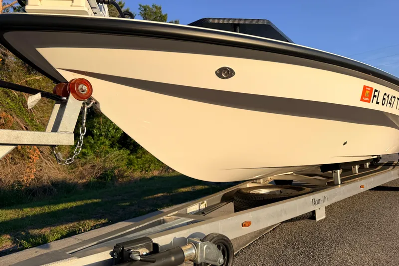 Slide: The Image of 2025 Chittum Skiffs Islamorada 21 on trailer, side view in sunlight. - 17