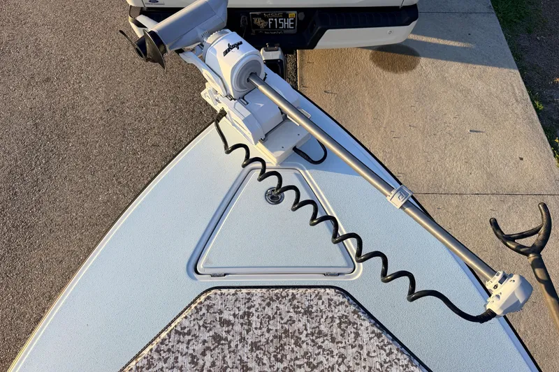 Slide: The Image of Bow of 2025 Chittum Skiffs Islamorada 21 with trolling motor and textured deck. - 20