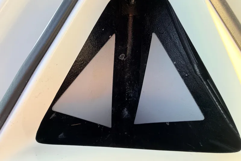 Slide: The Image of 2025 Chittum Skiffs Islamorada 21 boat detail, featuring a triangular design element. - 25