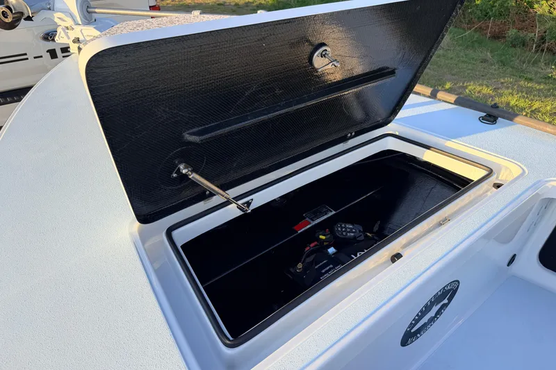 Slide: The Image of Open storage compartment on 2025 Chittum Skiffs Islamorada 21 boat. - 30