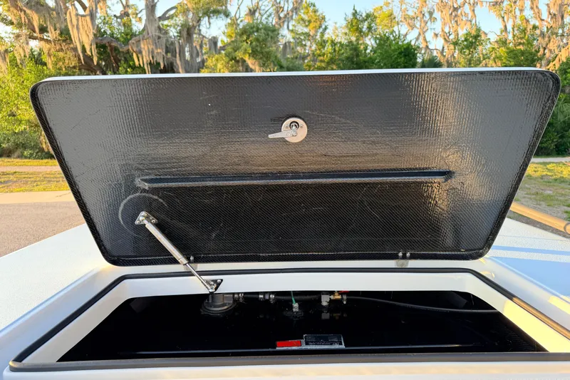 Slide: The Image of Open hatch of 2025 Chittum Skiffs Islamorada 21, showcasing interior components. - 31