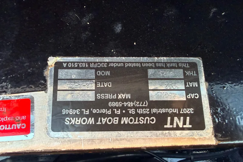 Slide: The Image of 2025 Chittum Skiffs Islamorada 21 boat label with specifications and manufacturing details. - 34