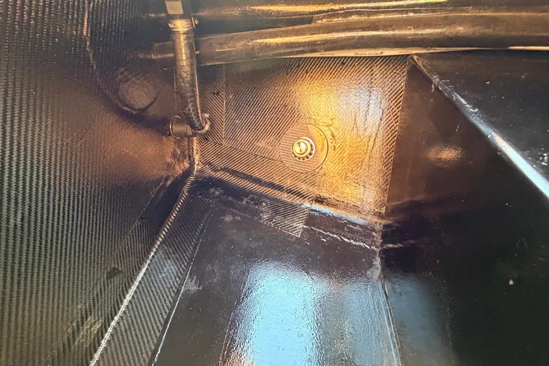 Slide: The Image of Interior view of 2025 Chittum Skiffs Islamorada 21, showcasing carbon fiber construction details. - 36