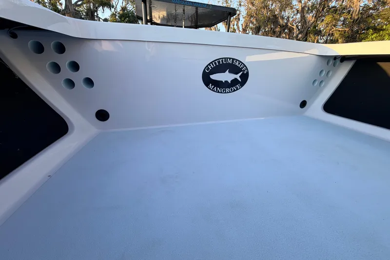 Slide: The Image of 2025 Chittum Skiffs Islamorada 21 interior with logo, showcasing sleek design and craftsmanship. - 38