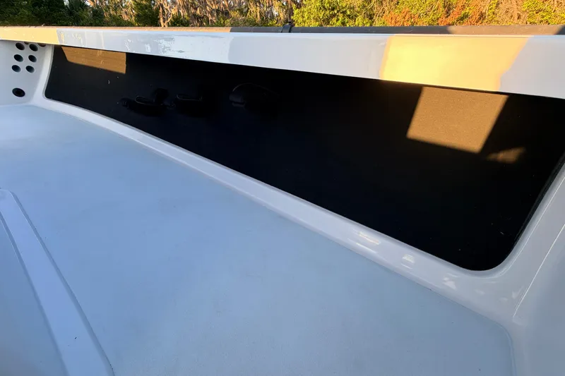 Slide: The Image of 2025 Chittum Skiffs Islamorada 21 interior detail with sunlight and shadow play. - 39