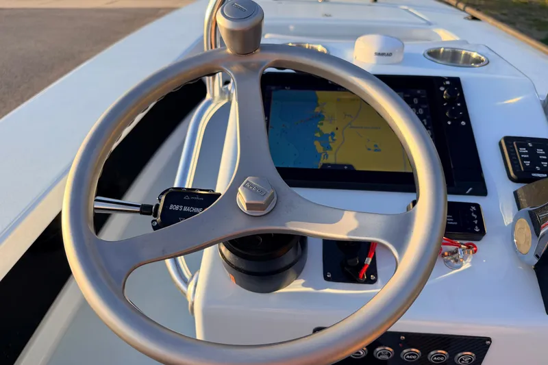 Slide: The Image of Steering wheel and navigation system of 2025 Chittum Skiffs Islamorada 21 boat. - 47