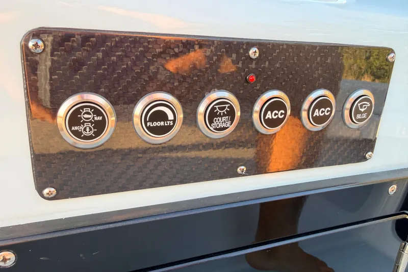Slide: The Image of Control panel of 2025 Chittum Skiffs Islamorada 21 with various function buttons. - 51