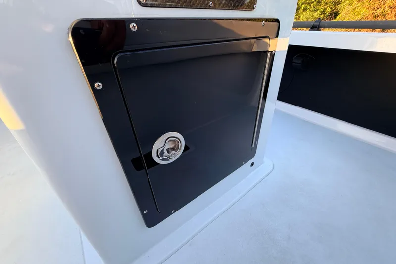 Slide: The Image of 2025 Chittum Skiffs Islamorada 21 boat console with storage compartment. - 53