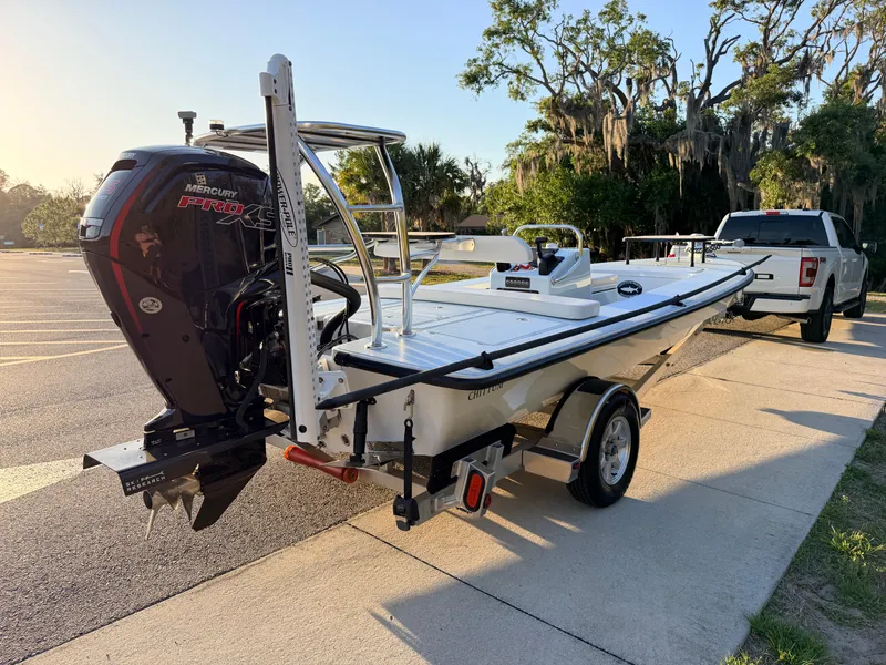 Slide: The Image of 2025 Chittum Skiffs Islamorada 21 boat with Mercury Pro XS engine on trailer. - 6