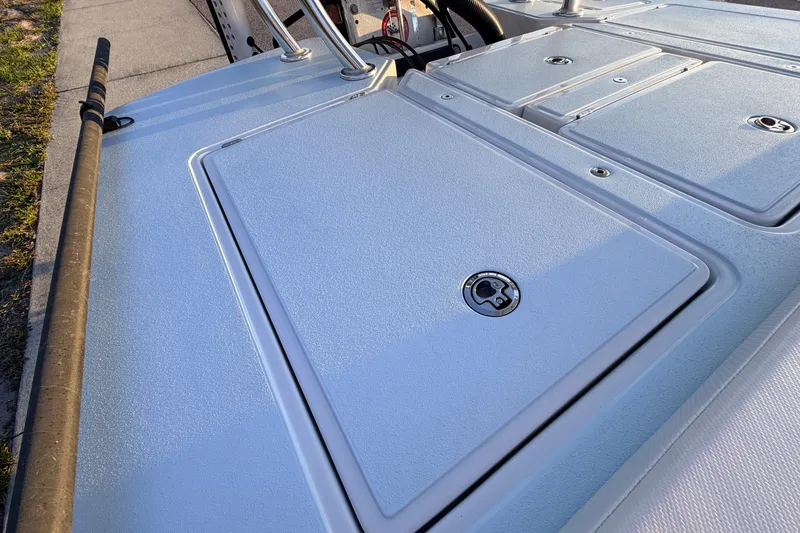 Slide: The Image of 2025 Chittum Skiffs Islamorada 21 deck with storage compartments and rod holder. - 61