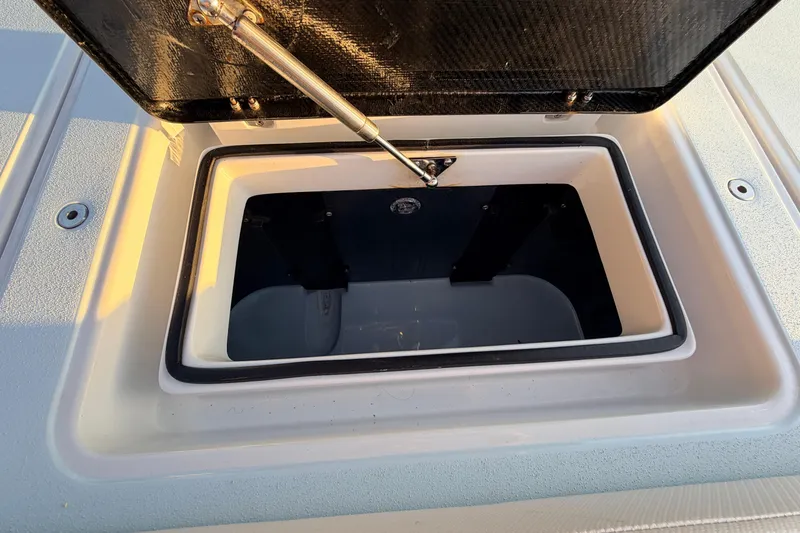 Slide: The Image of Open storage compartment on 2025 Chittum Skiffs Islamorada 21 boat. - 65