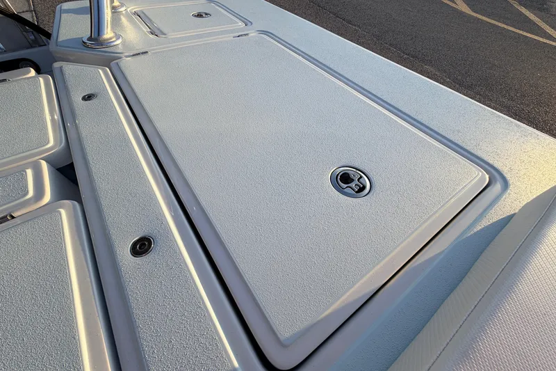 Slide: The Image of 2025 Chittum Skiffs Islamorada 21 deck with storage compartments and sleek design. - 67