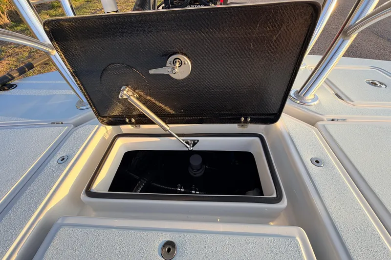 Slide: The Image of Open storage compartment on 2025 Chittum Skiffs Islamorada 21 boat deck. - 71