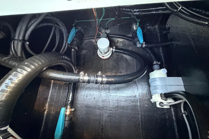 Slide: The Image of Bilge area of 2025 Chittum Skiffs Islamorada 21 with hoses and fittings. - 72