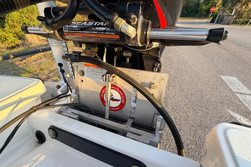 Slide: The Image of Close-up of 2025 Chittum Skiffs Islamorada 21 boat engine components and hydraulic steering system. - 73