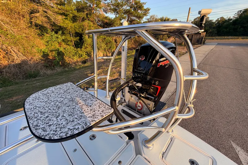 Slide: The Image of 2025 Chittum Skiffs Islamorada 21 with Mercury Pro XS engine, featuring a sturdy helm station. - 74