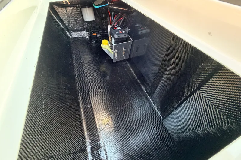 Slide: The Image of Interior view of 2025 Chittum Skiffs Islamorada 21, showcasing carbon fiber construction. - 80