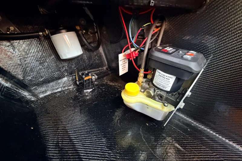 Slide: The Image of Interior view of a 2025 Chittum Skiffs Islamorada 21, showcasing wiring and components. - 81