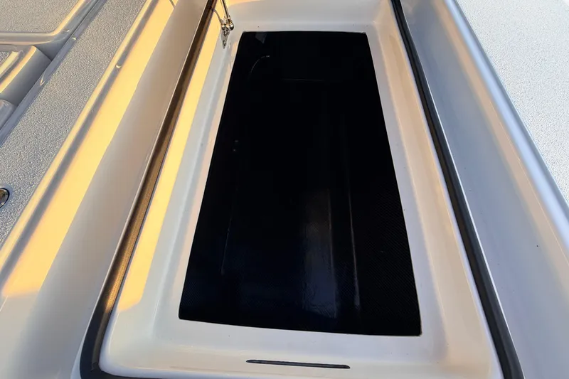 Slide: The Image of 2025 Chittum Skiffs Islamorada 21 storage compartment, showcasing sleek design and ample space. - 83