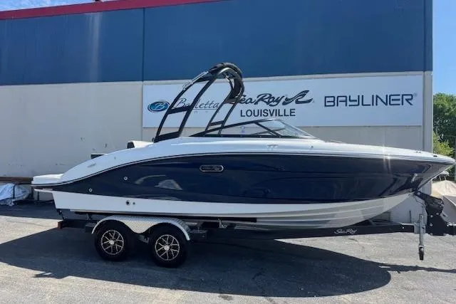 The Image of 2026 Sea Ray SPX 210 boat on trailer, parked outside dealership in Louisville. - 1
