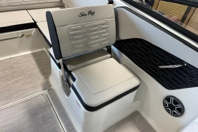 Slide: The Image of 2026 Sea Ray SPX 210 boat interior with cushioned seating and sleek design. - 10