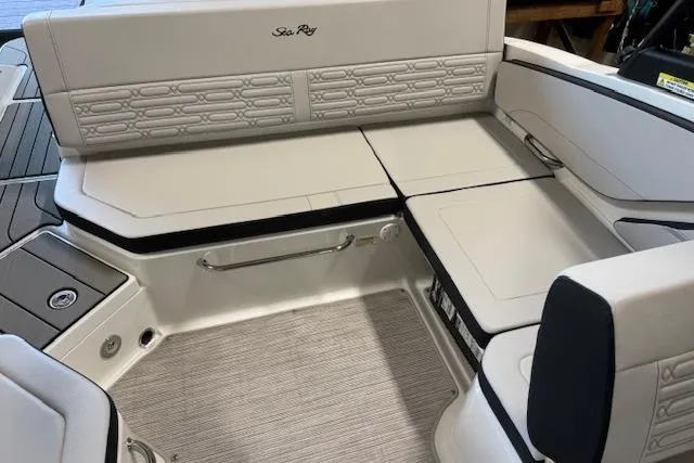 Slide: The Image of 2026 Sea Ray SPX 210 boat interior with sleek, modern seating and elegant design. - 11