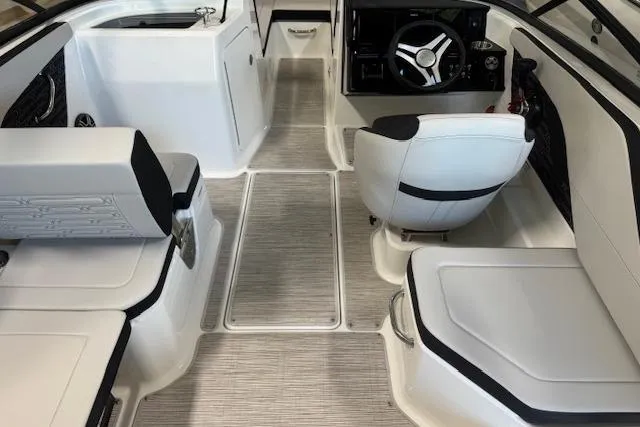 Slide: The Image of Interior of 2026 Sea Ray SPX 210 boat, featuring sleek seating and modern dashboard. - 15