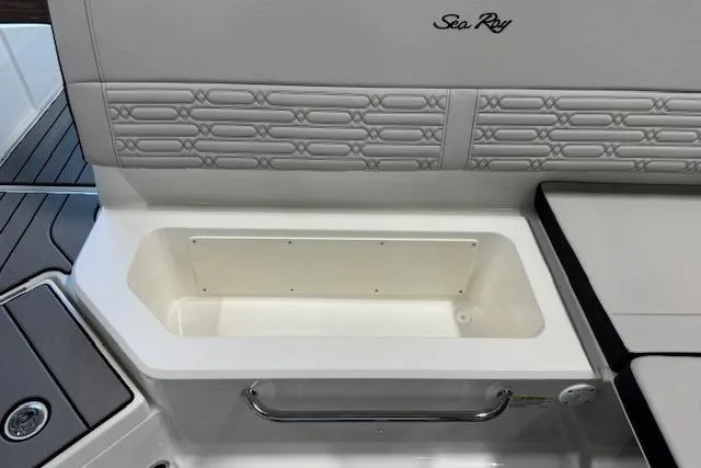Slide: The Image of 2026 Sea Ray SPX 210 boat interior with storage compartment and stylish seating. - 16