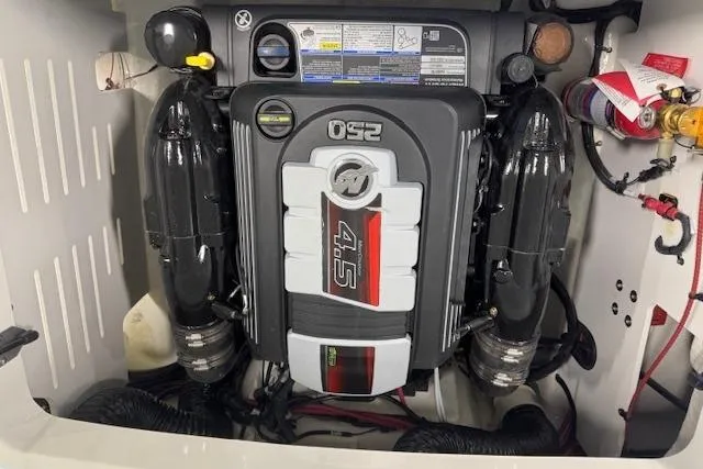 Slide: The Image of Engine compartment of a 2026 Sea Ray SPX 210 boat, featuring a 250 horsepower engine. - 18