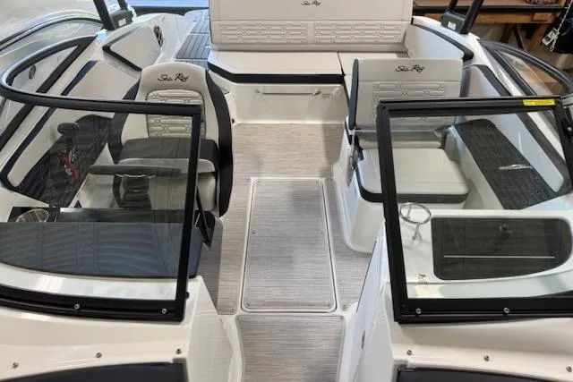Slide: The Image of 2026 Sea Ray SPX 210 boat interior with seating and glass windshields. - 7
