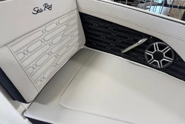 Slide: The Image of 2026 Sea Ray SPX 210 boat interior with stylish seating and speaker detail. - 8