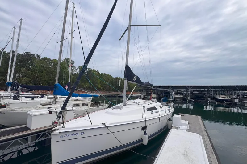 The Image of Sailboat docked at marina, Hunter 27 model, 2007, under cloudy sky. - 1