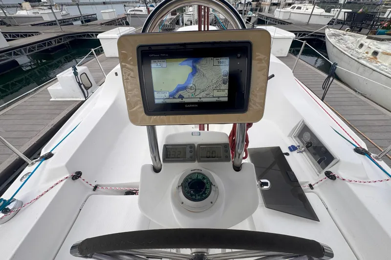 Slide: The Image of Cockpit of 2007 Hunter 27 sailboat with Garmin GPS and compass at marina. - 10