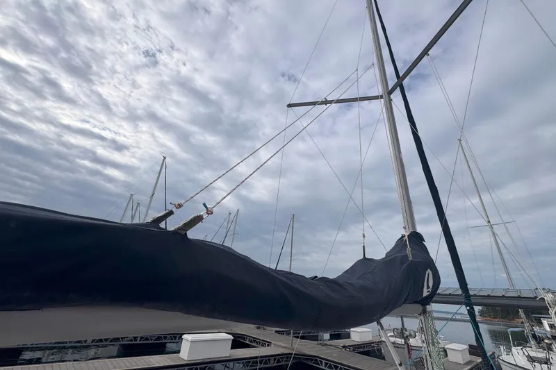 Slide: The Image of Sailboat mast and boom of a 2007 Hunter 27 under cloudy sky. - 13