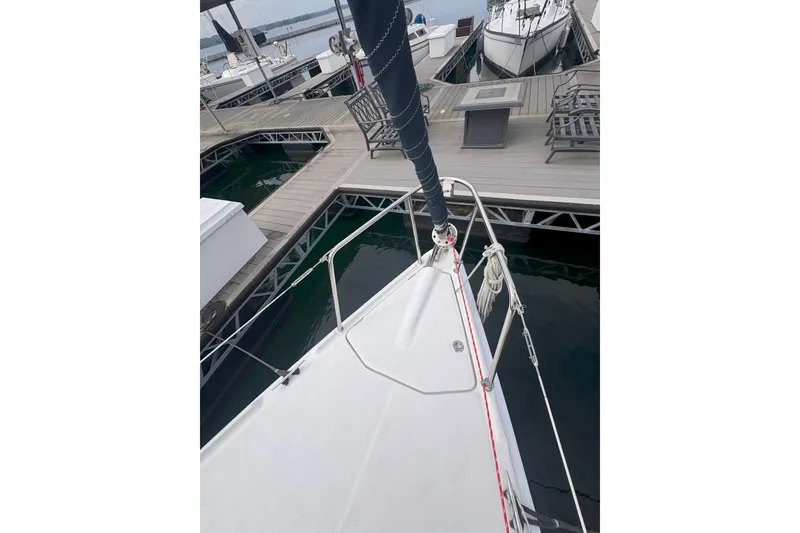 Slide: The Image of Bow of a 2007 Hunter 27 sailboat docked at a marina. - 15